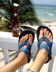 Dive-flag toe nails, ankle bracelet, toe ring, Cuban beer... by William Goodwin 